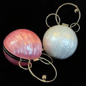 A PERSPEX ORBIT BAG WITH GOLD FITTINGS